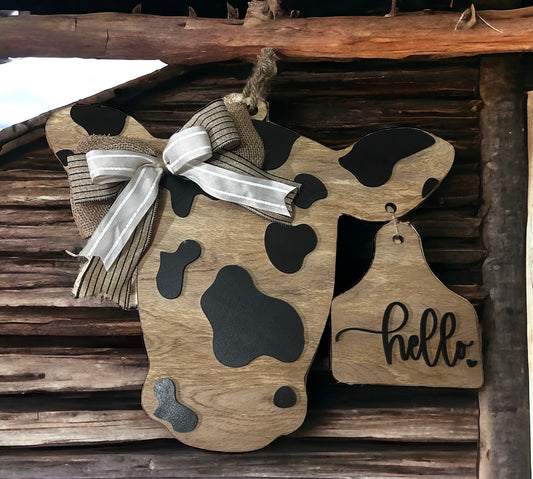 Cow door hanger with ear tag